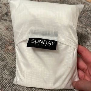 FREE - Sunday Riley rain poncho